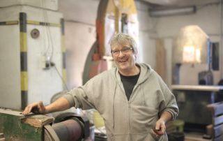 Machine Shop Worker Smiling For Camera